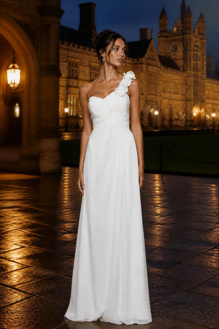 Model wearing white one-shoulder dress in the evening 
