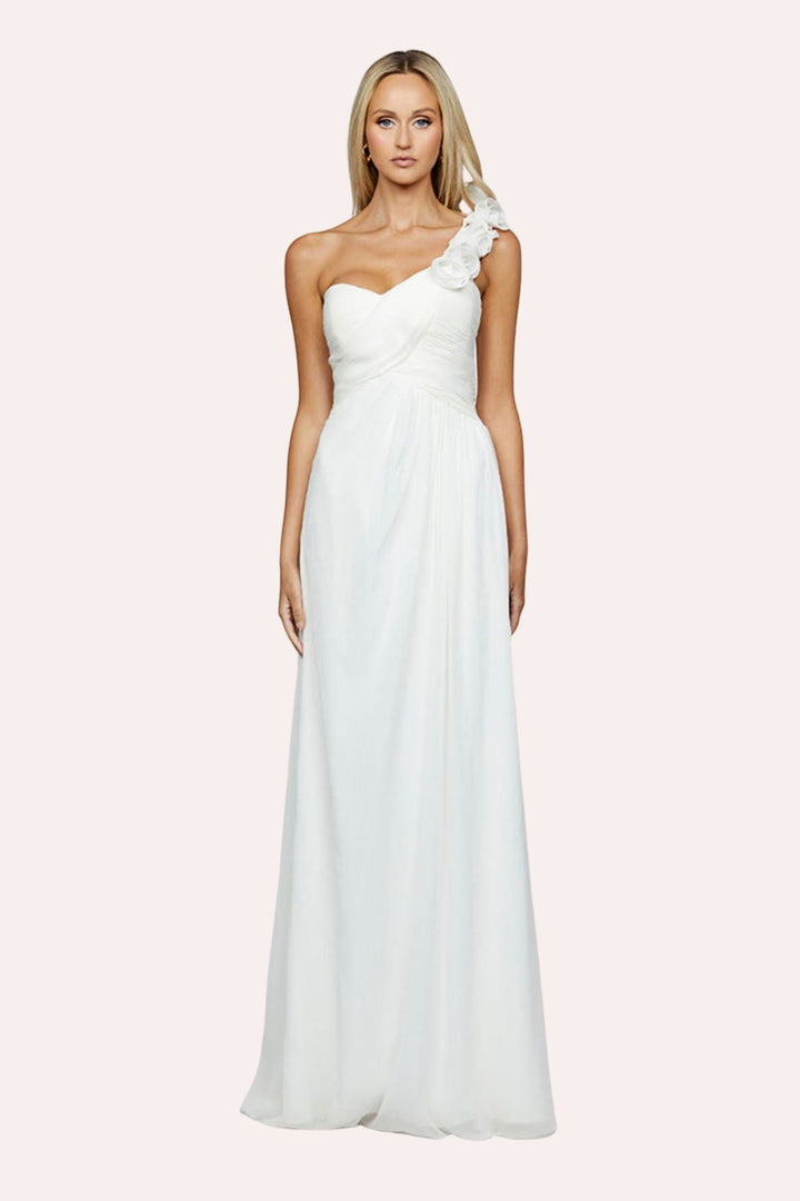 Model  showing front of a white one-shoulder dress with pink backdrop